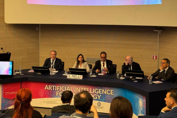Arsela Prelaj table directors from INT at the Artificial intelligence and Oncology congress